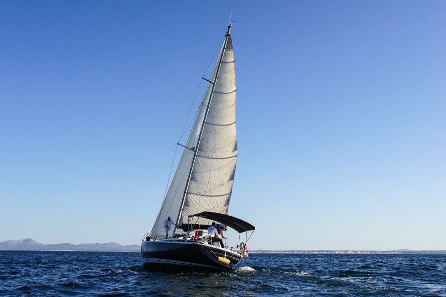 Alcudia: Sailing Yacht Excursion with Wine & Tapas - Reaching Cala en Gossalba by yacht