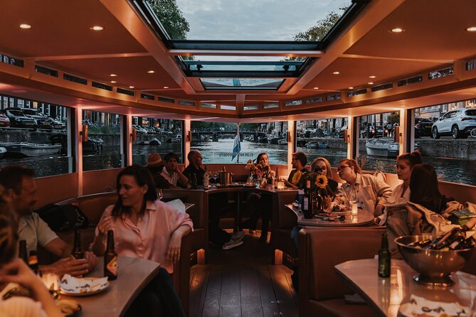 Amsterdam Small-Group Evening Canal Cruise Including Wine, Craft Beer, Cheese - Why Amsterdam looks better from a canal at night