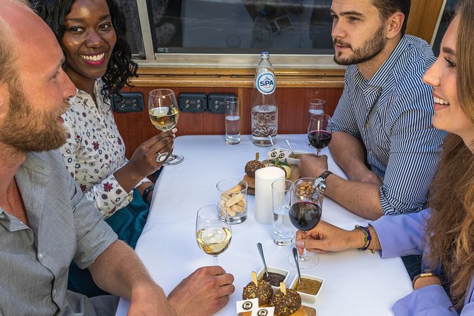 Amsterdam: Wine and Cheese Evening Cruise - What happens from check-in to departure