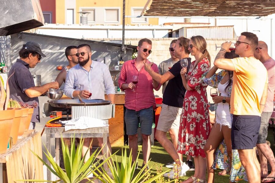 Barcelona: Rooftop Paella Cooking Class with Sangria - Eating the seafood paella you helped cook