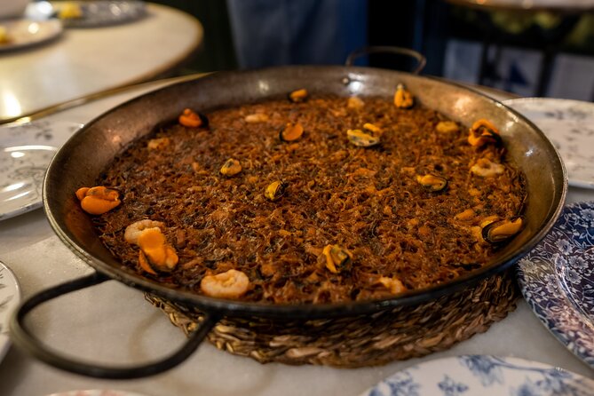 Barcelona Side Streets Tapas & Wine Tour - Walking beside the marina and Barceloneta
