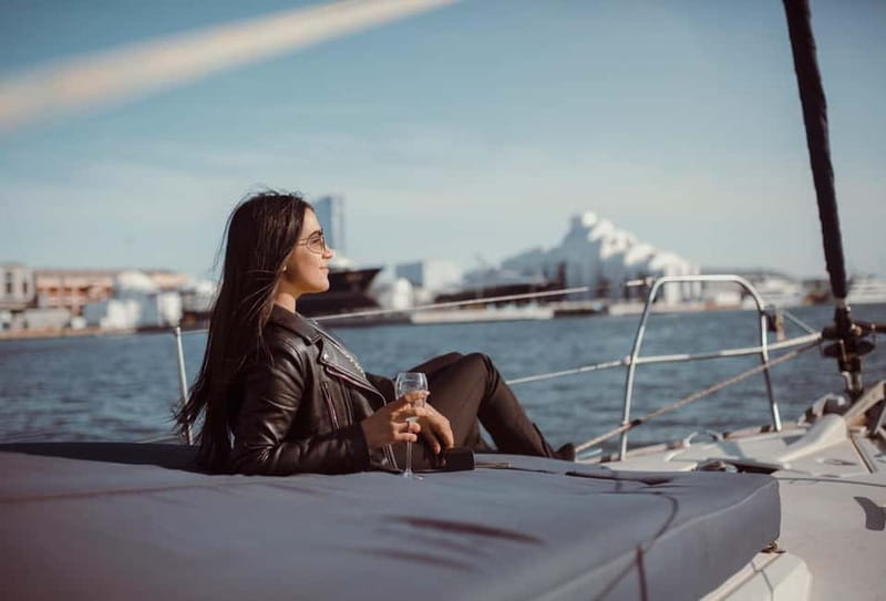Barcelona: Sunset Boat Trip with Cava Wine and Snacks - Swimming and steering the sailboat