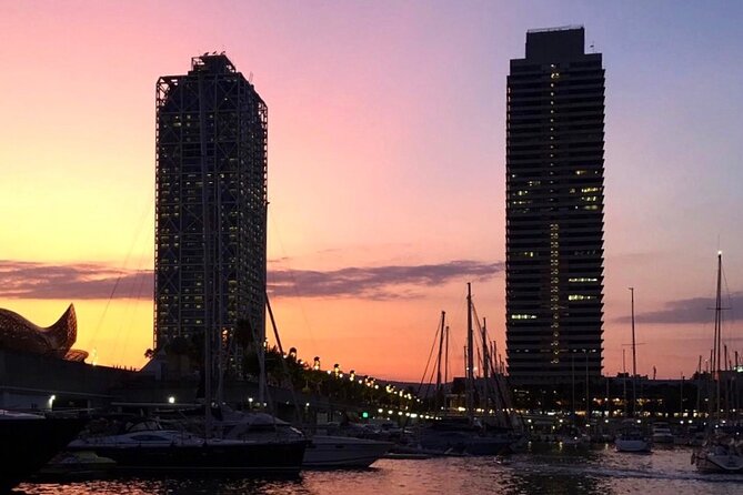 Barcelona Sunset Sailing with Open Bar of Cava and Snacks - Leaving Port Olímpic as Barcelona lights up