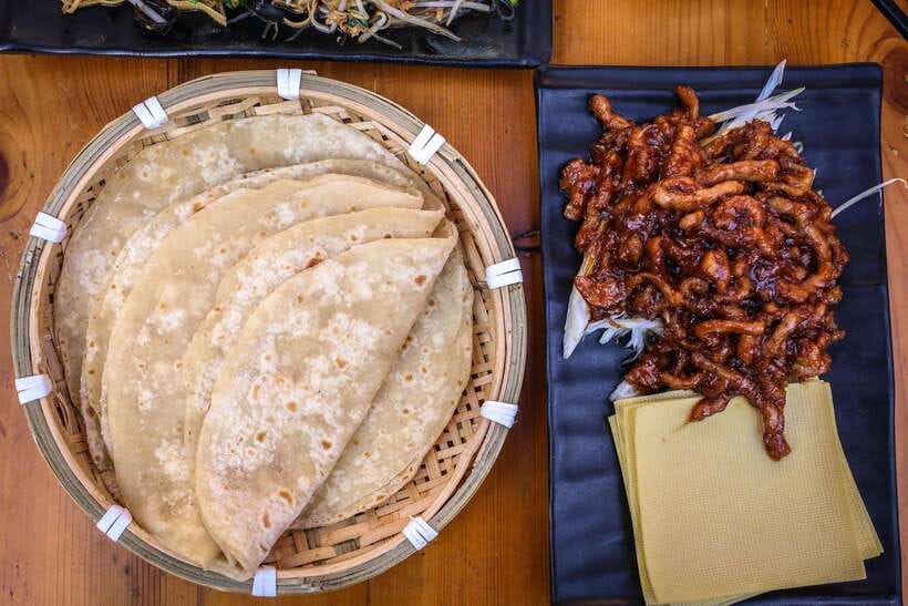Beijing: Hidden Gems Guided Food Tour with Beer and Tastings - Beijing noodles in a tiny courtyard restaurant