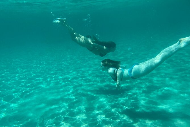 Boat Tour at Devil's Saddle: 4 Swim Stops, Snorkeling & Prosecco - Calamosca Beach adds a sheltered coastal view