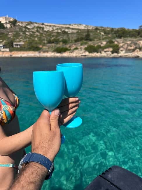 Cagliari: Boat Cruise with Stops for Swimming and Prosecco - Music, wine, and the right kind of atmosphere