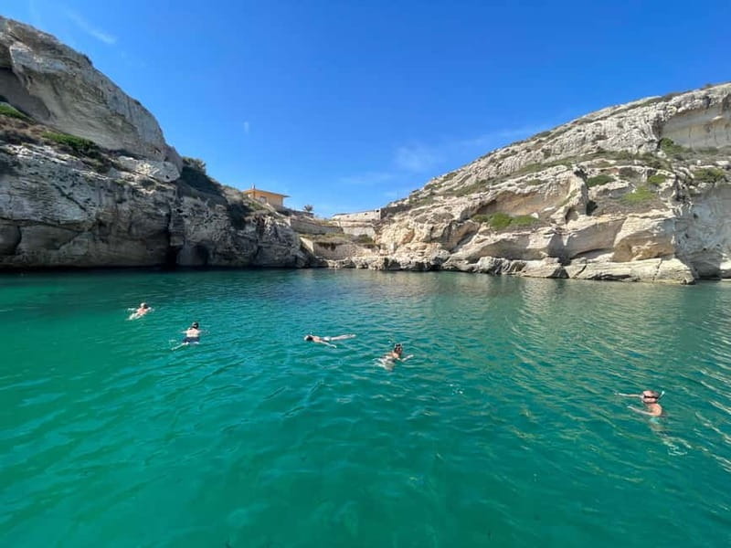Cagliari: Boat Tour with 4 Swim Stops, Snorkeling & Prosecco - Four clear-water stops around Devil’s Saddle