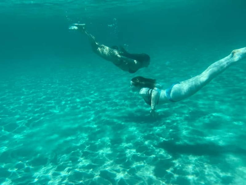 Cagliari: Boat Tour with 4 Swim Stops, Snorkeling & Prosecco - What guides add to the experience