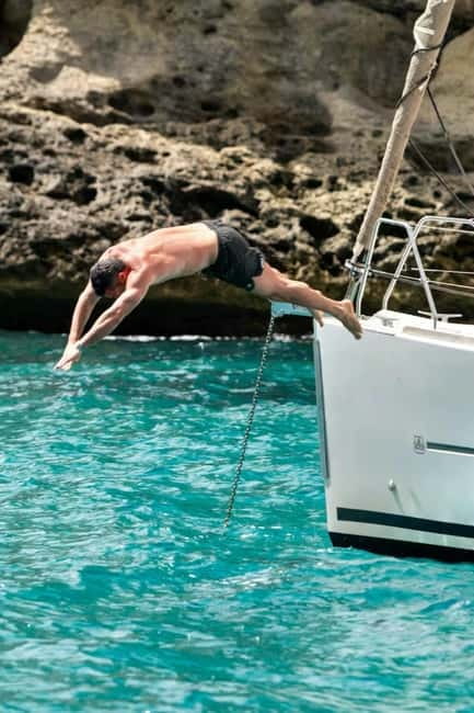 Cagliari: Catamaran Tour, Swimming, Snorkeling, & Prosecco - Cala Fighera and the coast’s pale cliffs