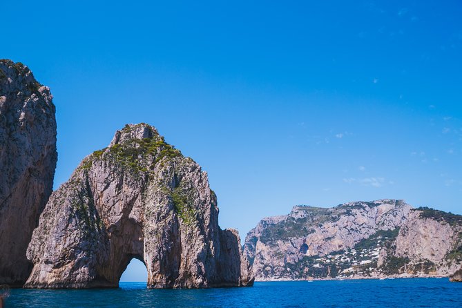 Capri Boat Tour: Grottoes, Swim & Sip Limoncello in a Small Group - The grottoes: three different moods in one short ride