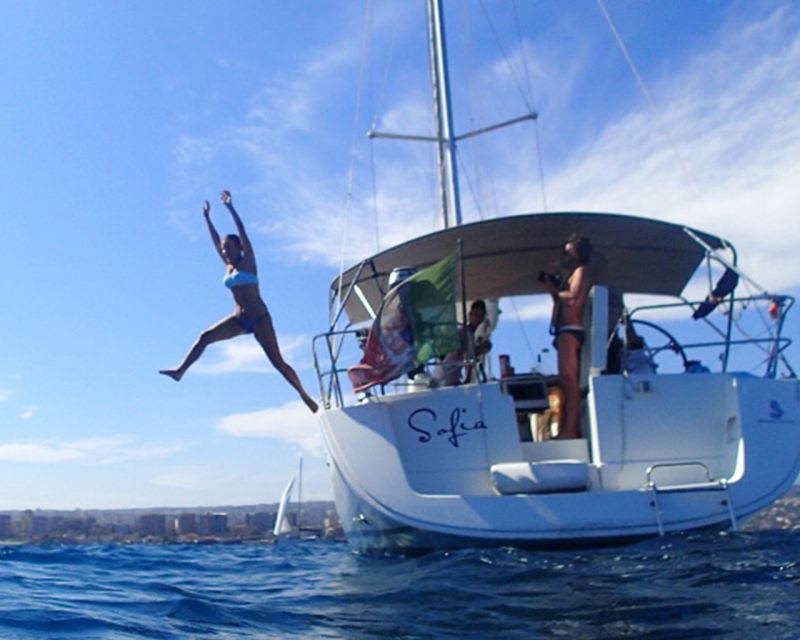 Catania: Coastline Sailing Trip with Aperitif and Prosecco - Catania’s volcanic coast from the water