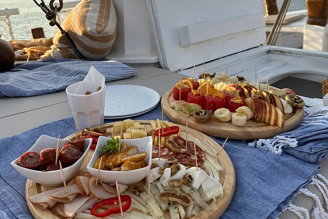 Corfu: Sunset Cruise on a Wooden Vessel with Cocktails & Bites - Mon Repos adds a royal and archaeological layer