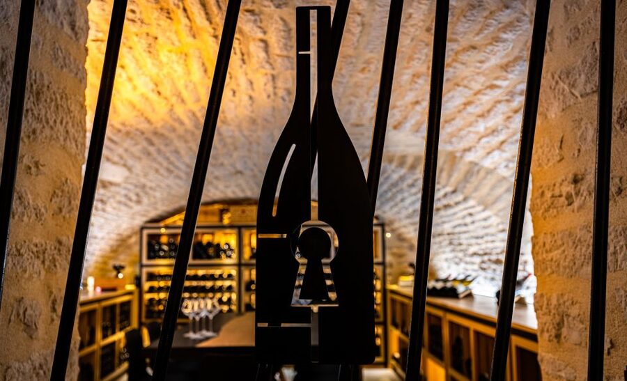 Dijon: La Cave du Palais Burgundy Wine Tasting Experience - Entering La Cave du Palais beneath the Hotel du Palais