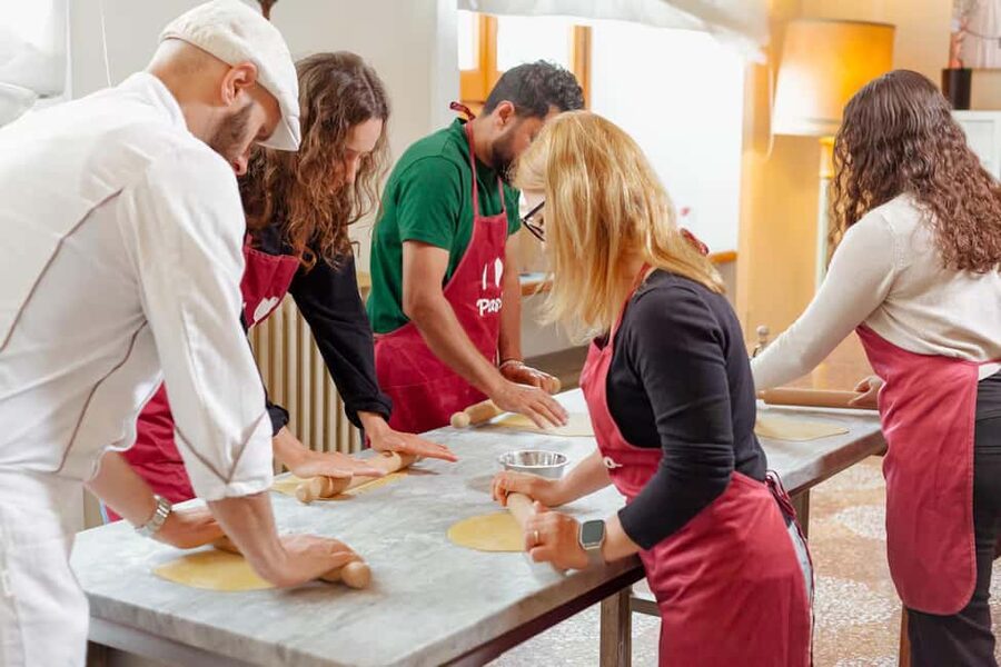Florence: Pasta Class with Wine, Limoncello and Dessert - Making pasta beside Ponte Vecchio