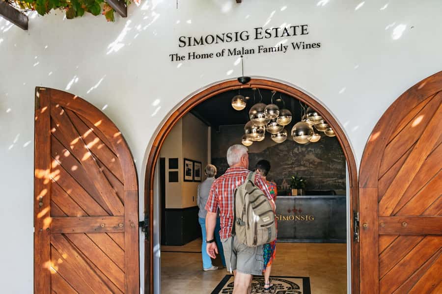 From Cape Town: 3 Regions Wine Tour with 3 Estates, 15 Wines - Franschhoek sights and the Mandela photo stop