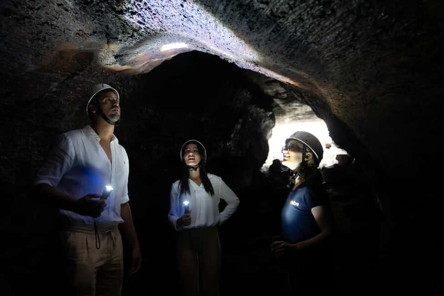 From Catania: trek on Mount Etna, Lava Cave & tasting Tour - Entering Grotta Lunga with a helmet and lamp