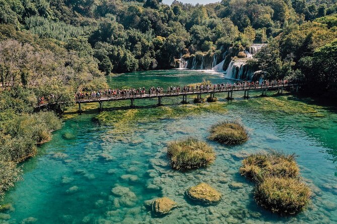 From Split: Krka Waterfalls, Food & Wine Tasting Tour - Walking through Krka National Park