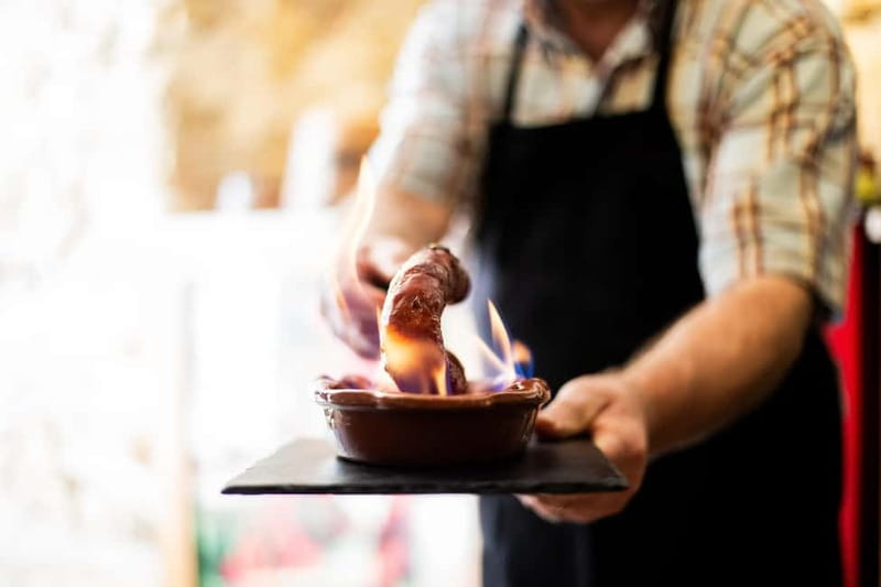 Lisbon: Food Tasting Tour by Tuk Tuk with 2 Stops - The first tasting: food, wine, and local conversation