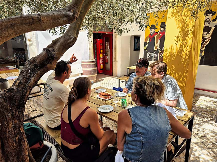 Lisbon Small-Group Food & Wine Tour Eat & Drink like a Local - Flame-grilled chouriço with Portuguese red wine