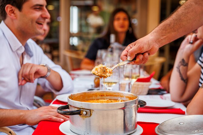 Lisbon Small-Group Portuguese Food and Wine Tour - Rossio Square starts with cod cake and green wine