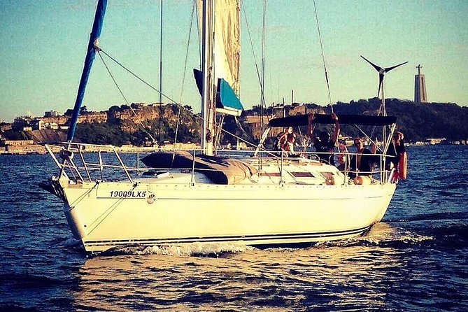 Lisbon Sunset Sailing Tour with White or Rosé Wine and Snacks - Passing beneath the 25 de Abril Bridge