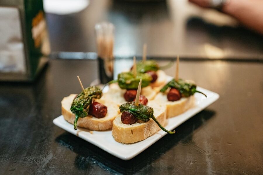 Madrid: Food & Wine Tour with 10 Tapas & 4 Drinks Included - Four Madrid food stops beyond the tourist center