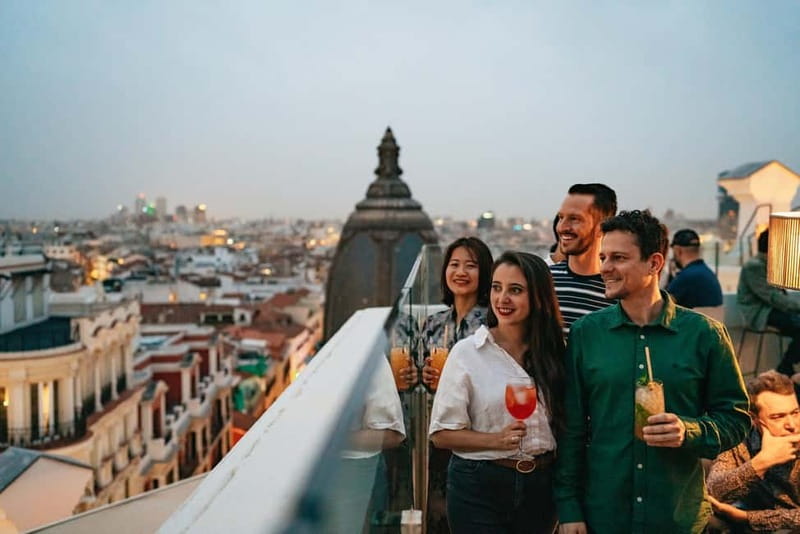 Madrid: Guided Tapas and Wine Tour with Rooftop Views - Iberian ham, sausages, and the walk across Plaza Mayor