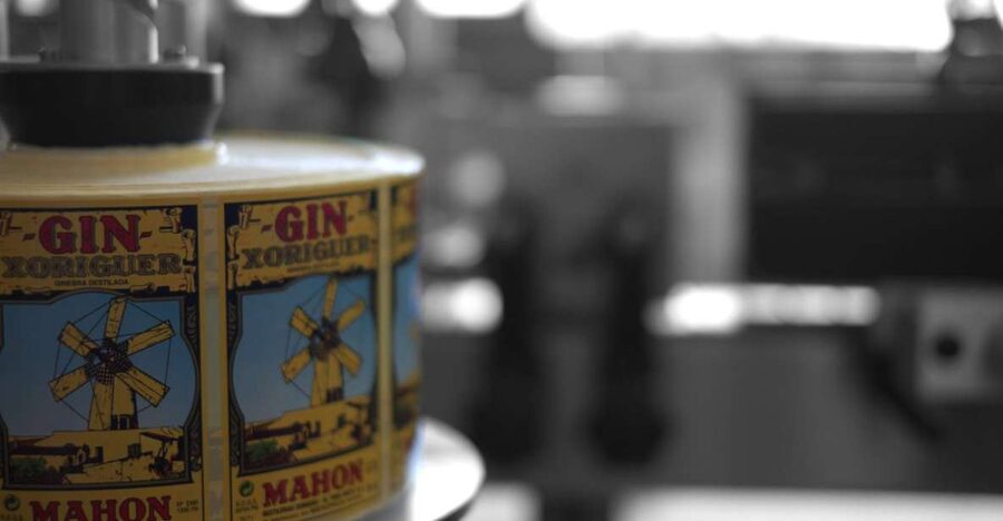 Mahón: Gin Distillery Tour with Tasting & Appetizers - Entering the Xoriguer distillery in Mahón