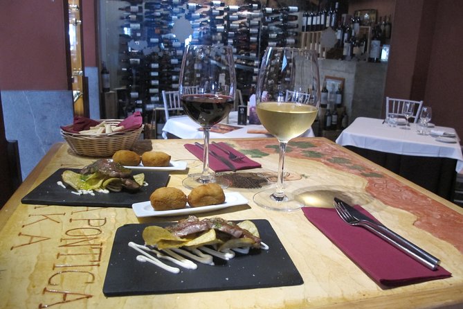 Malaga Wine & Tapas Small Group Guided Tour - Iberian ham and vermouth at the ultramarinos