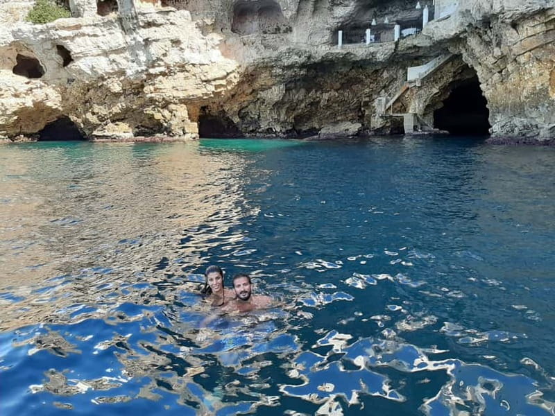 Polignano a Mare: Boat Tour with Prosecco and Snacks - Prosecco, taralli, and music aboard