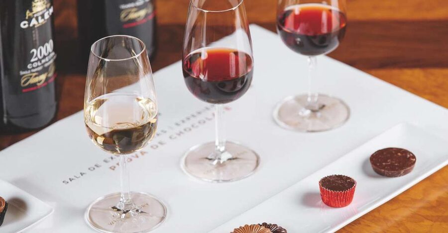 Porto: Cálem Cellar with Chocolate, Cheese, and Wine Tasting - Walking through an active Port cellar