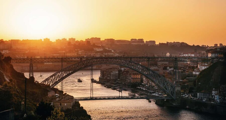 Porto: Sunset Walking Tour with Port Wine and Views - Porto Cathedral and the walk toward the bridge