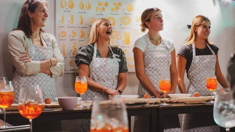 Rome Cooking Class: Make Pasta and 3 Spritz Cocktails - A pasta class with a cocktail in hand