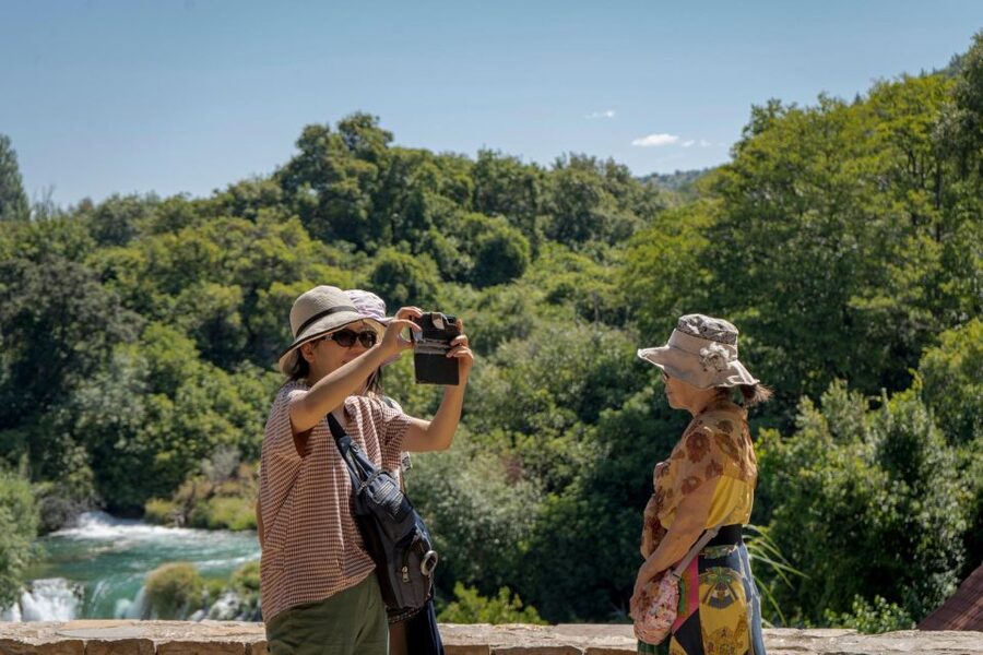 Split: Krka Waterfalls With Boat Cruise, Wine and Olive Oil - Walking the wooden paths at Skradinski buk